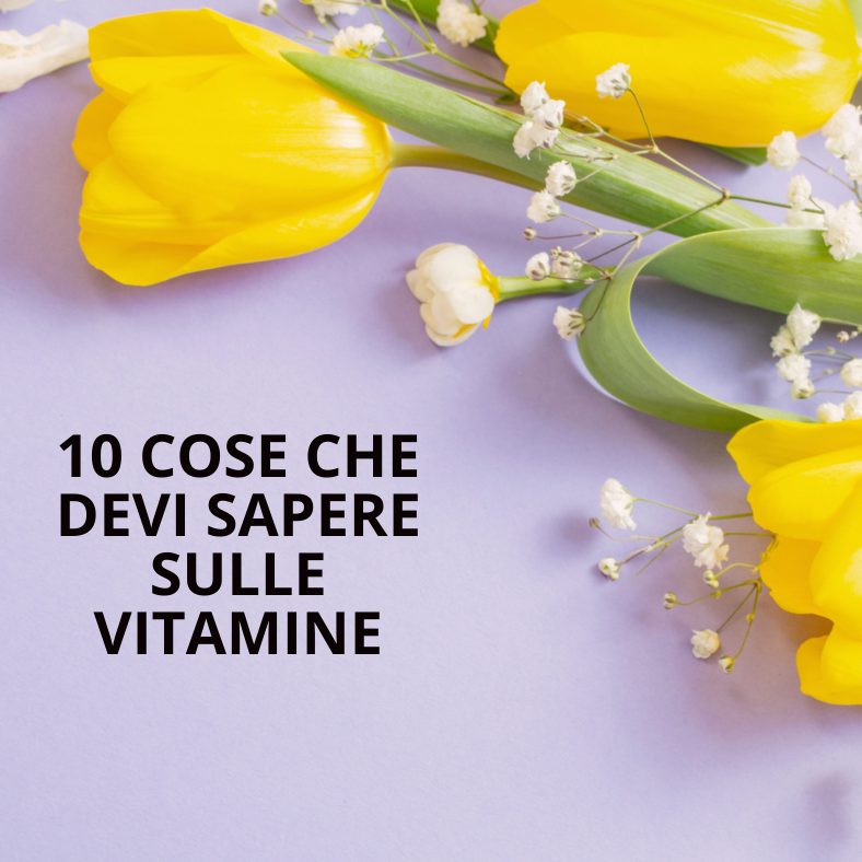 le vitamine titolo su sfondo con tulipani gialli